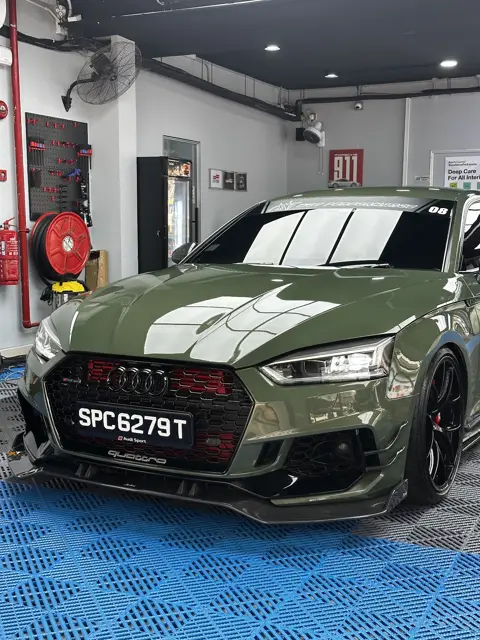 Green Audi RS parked in the KOYA bay