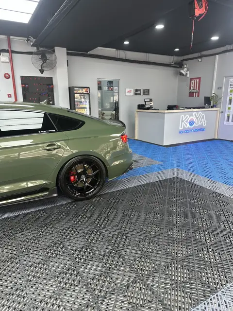 Green Audi RS5 in the KOYA bay