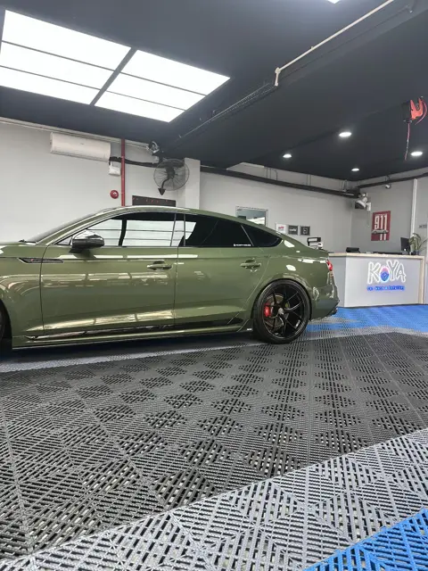 Green Audi RS5 in the KOYA bay