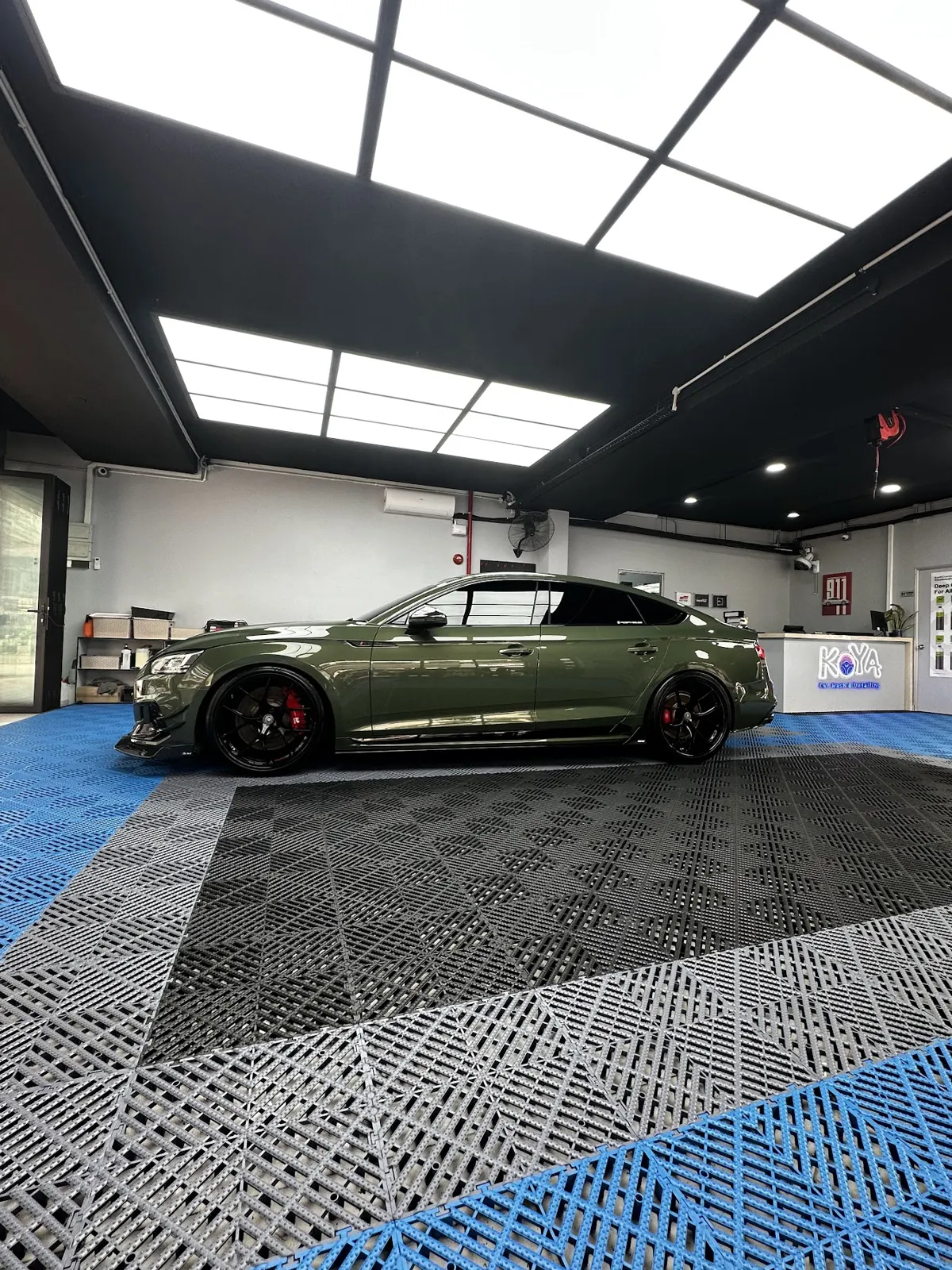 Green Audi RS5 in the KOYA bay
