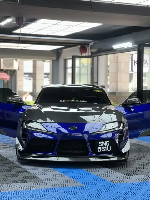 Blue Toyota Supra with carbon bonnet at KOYA