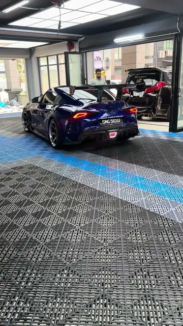 Blue Supra rear three-quarter