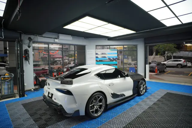 White Toyota Supra rear three-quarter in the KOYA bay